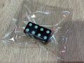 Teal on black mahjong dice
