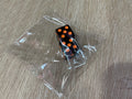 Orange on black mahjong dice